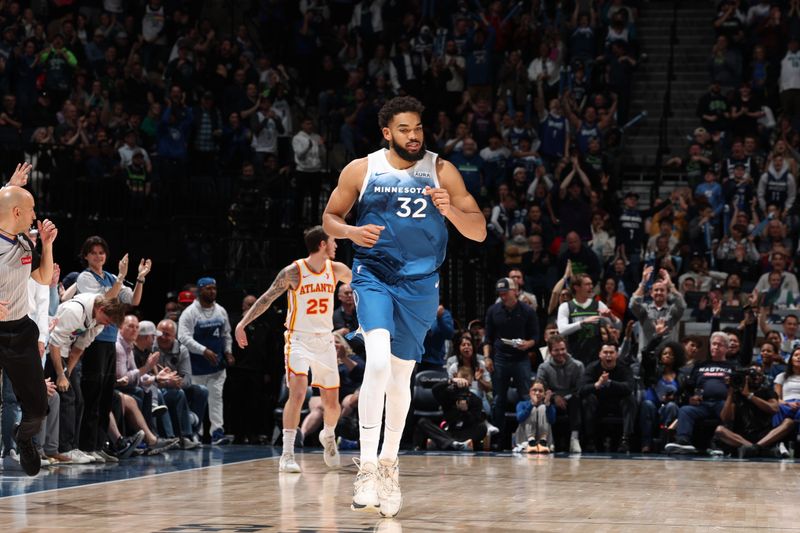 MINNEAPOLIS, MN -  APRIL 12:  Karl-Anthony Towns #32 of the Minnesota Timberwolves looks on during the game against the Atlanta Hawks on April 12, 2024 at Target Center in Minneapolis, Minnesota. NOTE TO USER: User expressly acknowledges and agrees that, by downloading and or using this Photograph, user is consenting to the terms and conditions of the Getty Images License Agreement. Mandatory Copyright Notice: Copyright 2024 NBAE (Photo by David Sherman/NBAE via Getty Images)