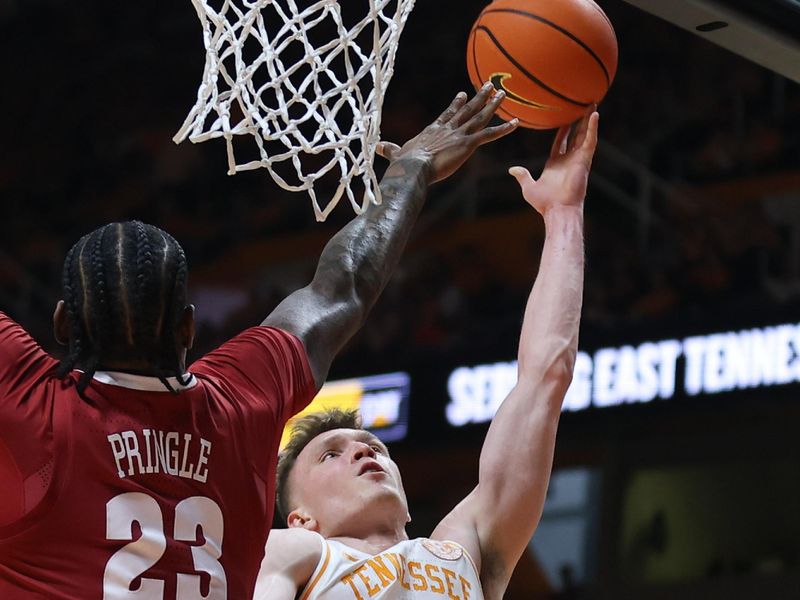 Jan 20, 2024; Knoxville, Tennessee, USA; Tennessee Volunteers guard Dalton Knecht (3) goes to the basket against Alabama Crimson Tide forward Nick Pringle (23) during the second half at Thompson-Boling Arena at Food City Center. Mandatory Credit: Randy Sartin-USA TODAY Sports