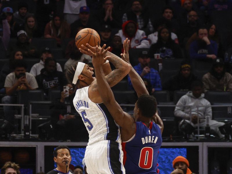 DETROIT, MI - FEBRUARY 24:  Paolo Banchero #5 of the Orlando Magic shoots the game winning basket during the game against the Detroit Pistons  on February 24, 2024 at Little Caesars Arena in Detroit, Michigan. NOTE TO USER: User expressly acknowledges and agrees that, by downloading and/or using this photograph, User is consenting to the terms and conditions of the Getty Images License Agreement. Mandatory Copyright Notice: Copyright 2024 NBAE (Photo by Brian Sevald/NBAE via Getty Images)