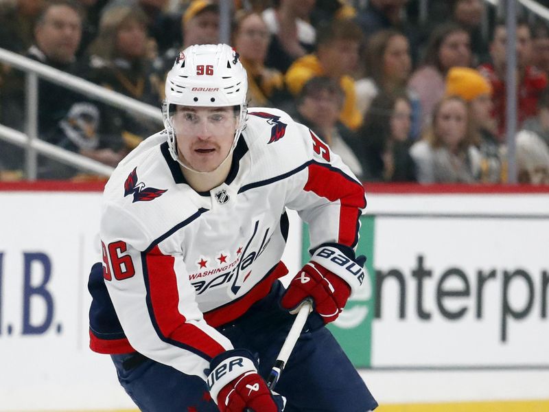 Jan 2, 2024; Pittsburgh, Pennsylvania, USA;  Washington Capitals right wing Nicolas Aube-Kubel (96) skates up ice with the puck against the Pittsburgh Penguins during the second period at PPG Paints Arena. Mandatory Credit: Charles LeClaire-USA TODAY Sports