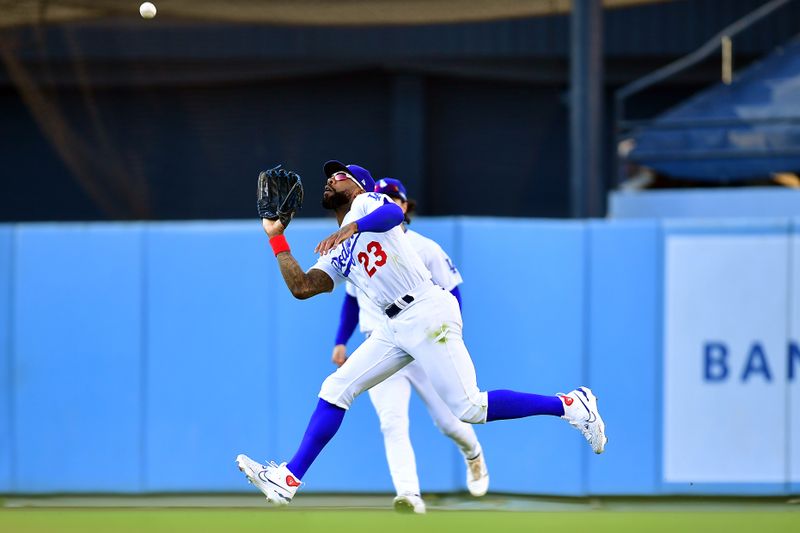 Jun 25, 2023; Los Angeles, California, USA; Los Angeles Dodgers right fielder Jason Heyward (23) catches the fly ball ofHouston Astros right fielder Kyle Tucker (30) during the eleventh inning at Dodger Stadium. Mandatory Credit: Gary A. Vasquez-USA TODAY Sports