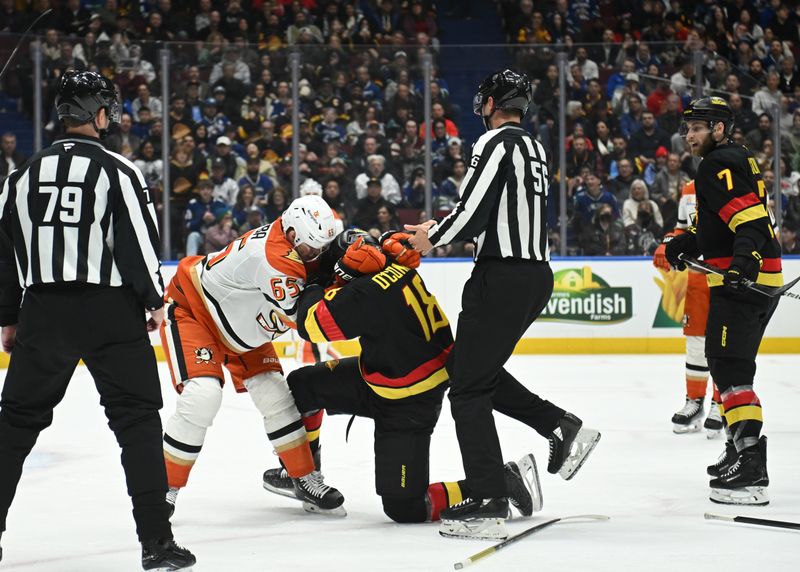 Mar 5, 2025; Vancouver, British Columbia, CAN; Anaheim Ducks defenseman Jacob Trouba (65) fights with Vancouver Canucks forward Drew O'Connor (18) during the third period at Rogers Arena. Mandatory Credit: Simon Fearn-Imagn Images