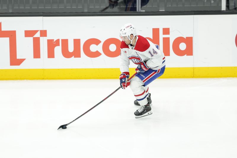 Jan 14, 2025; Salt Lake City, Utah, USA;  Montreal Canadiens center Nick Suzuki (14) controls the puck during the second period against the Utah Hockey Club at Delta Center. Mandatory Credit: Chris Nicoll-Imagn Images
