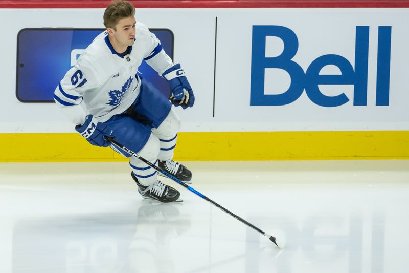 Jan 25, 2025; Ottawa, Ontario, CAN; Toronto Maple Leafs center Jacob Quillan (61) skates on his own during warmup prior to his first NHL game to be played against Ottawa Senators  at the Canadian Tire Centre. Mandatory Credit: Marc DesRosiers-Imagn Images