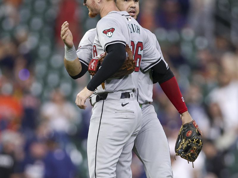 Sep 8, 2024; Houston, Texas, USA; Arizona Diamondbacks left fielder Pavin Smith (26) celebrates with third baseman Eugenio Suarez (28) after the game against the Houston Astros at Minute Maid Park. Mandatory Credit: Troy Taormina-Imagn Images