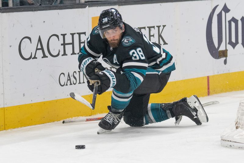 Feb 29, 2024; San Jose, California, USA; San Jose Sharks defenseman Mario Ferraro (38) passes the puck during the third period against the Anaheim Ducks at SAP Center at San Jose. Mandatory Credit: Stan Szeto-USA TODAY Sports