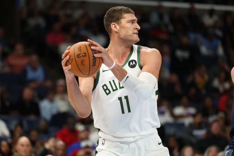 MEMPHIS, TENNESSEE - OCTOBER 31: Brook Lopez #11 of the Milwaukee Bucks looks to pass the ball against the Memphis Grizzlies during the second half  at FedExForum on October 31, 2024 in Memphis, Tennessee. NOTE TO USER: User expressly acknowledges and agrees that, by downloading and or using this Photograph, user is consenting to the terms and conditions of the Getty Images License Agreement. (Photo by Wes Hale/Getty Images)