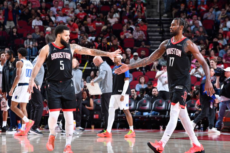 HOUSTON, TX - MARCH 14: Fred VanVleet #5 and Tari Eason #17 of the Houston Rockets high five during the game against the Dallas Mavericks on March 14, 2025 at the Toyota Center in Houston, Texas. NOTE TO USER: User expressly acknowledges and agrees that, by downloading and or using this photograph, User is consenting to the terms and conditions of the Getty Images License Agreement. Mandatory Copyright Notice: Copyright 2025 NBAE (Photo by Logan Riely/NBAE via Getty Images)