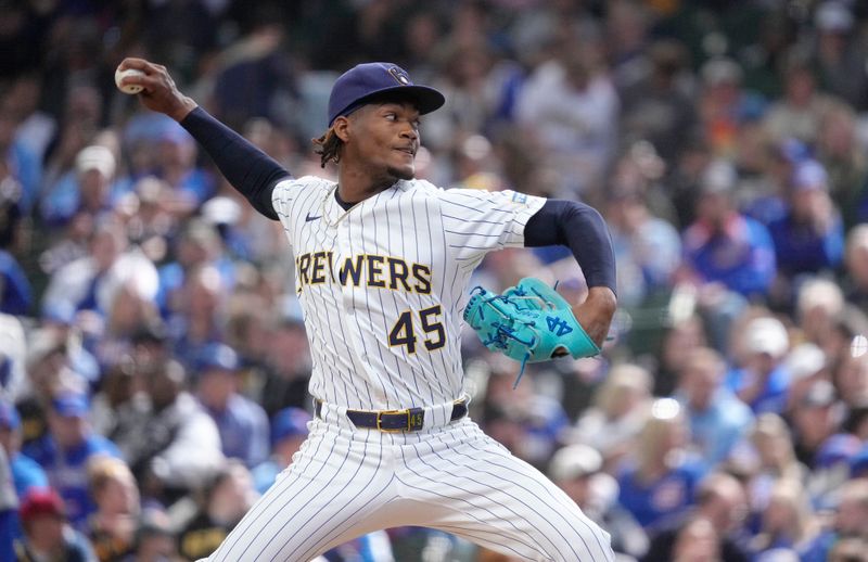 May 4, 2025; Milwaukee, Wisconsin, USA; Milwaukee Brewers pitcher Abner Uribe (45) delivers a pitch against the Chicago Cubs in the eighth inning at American Family Field. Mandatory Credit: Michael McLoone-Imagn Images