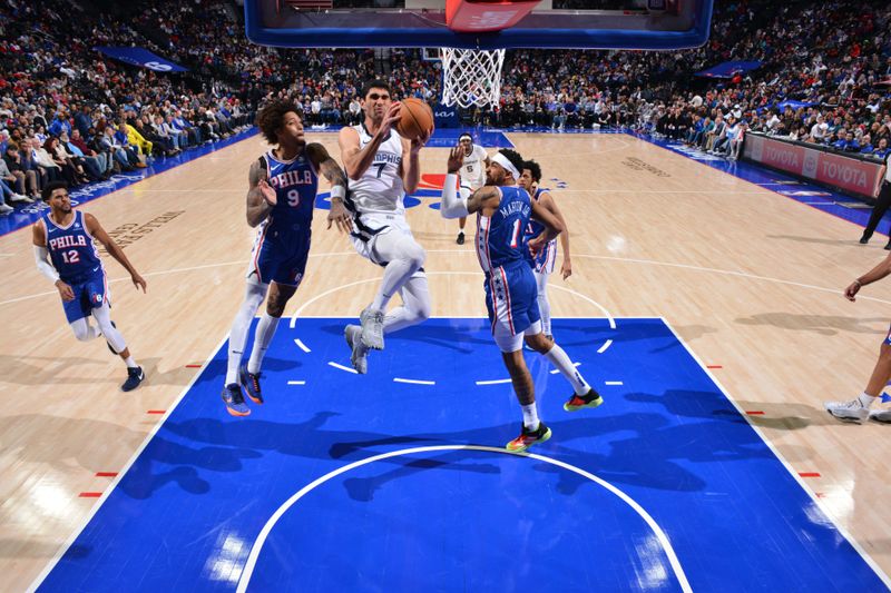 PHILADELPHIA, PA - MARCH 6:  Santi Aldama #7 of the Memphis Grizzlies drives to the basket during the game against the Philadelphia 76ers on March 6, 2024 at the Wells Fargo Center in Philadelphia, Pennsylvania NOTE TO USER: User expressly acknowledges and agrees that, by downloading and/or using this Photograph, user is consenting to the terms and conditions of the Getty Images License Agreement. Mandatory Copyright Notice: Copyright 2024 NBAE (Photo by Jesse D. Garrabrant/NBAE via Getty Images)