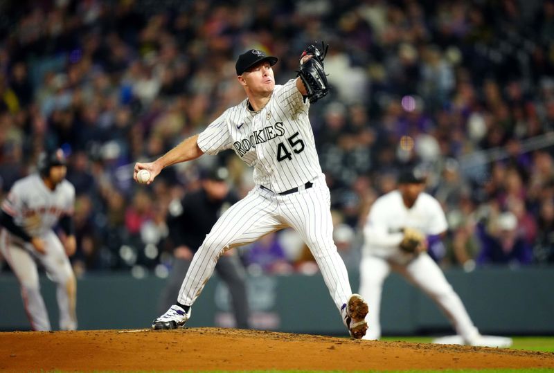 Sep 15, 2023; Denver, Colorado, USA; Colorado Rockies starting pitcher Chase Anderson (45) delivers a pitch in the sixth inning against the San Francisco Giants at Coors Field. Mandatory Credit: Ron Chenoy-USA TODAY Sports