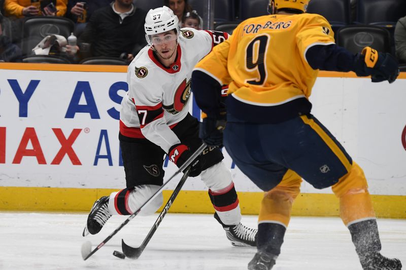 Feb 27, 2024; Nashville, Tennessee, USA; Ottawa Senators center Shane Pinto (57) skates with the puck against Nashville Predators left wing Filip Forsberg (9) during the second period at Bridgestone Arena. Mandatory Credit: Christopher Hanewinckel-USA TODAY Sports