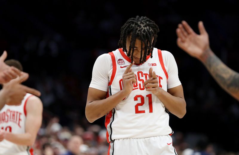 Jan 20, 2024; Columbus, Ohio, USA;  Ohio State Buckeyes forward Devin Royal (21) celebrates a play during the second half against the Penn State Nittany Lions at Value City Arena. Mandatory Credit: Joseph Maiorana-USA TODAY Sports