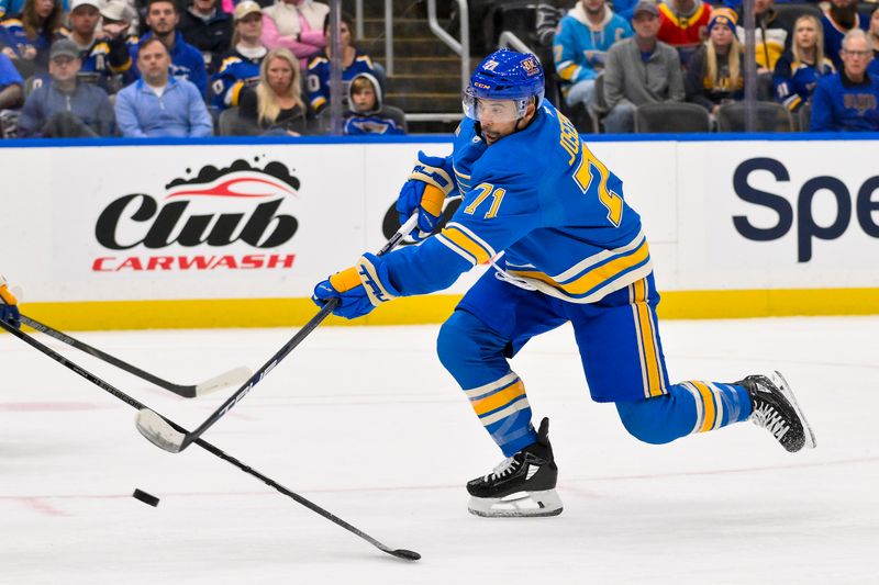 Oct 19, 2024; St. Louis, Missouri, USA;  St. Louis Blues right wing Mathieu Joseph (71) shoots and scores against the Carolina Hurricanes during the second period at Enterprise Center. Mandatory Credit: Jeff Curry-Imagn Images