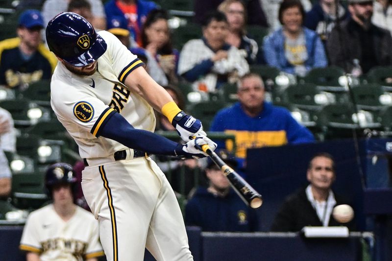 Apr 5, 2023; Milwaukee, Wisconsin, USA; Milwaukee Brewers second baseman Owen Miller (6) drives in a run with a base hit in the second inning against the New York Mets at American Family Field. Mandatory Credit: Benny Sieu-USA TODAY Sports