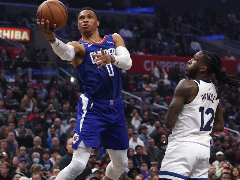 LOS ANGELES, CALIFORNIA - FEBRUARY 28: Russell Westbrook #0 of the LA Clippers attempts a layup as he is fouled by Taurean Prince #12 of the Minnesota Timberwolves during the first half at Crypto.com Arena on February 28, 2023 in Los Angeles, California. NOTE TO USER: User expressly acknowledges and agrees that, by downloading and or using this photograph, user is consenting to the terms and conditions of the Getty Images License Agreement. (Photo by Harry How/Getty Images)