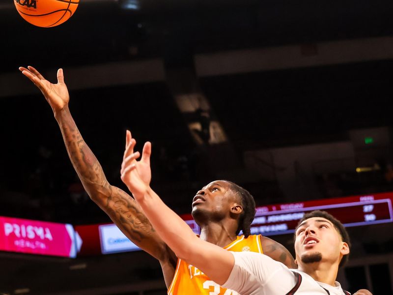 Mar 3, 2026; Columbia, South Carolina, USA; Tennessee Volunteers center Felix Okpara (34) and South Carolina Gamecocks forward EJ Walker (6) battle for a rebound in the second half at Colonial Life Arena. Mandatory Credit: Jeff Blake-Imagn Images