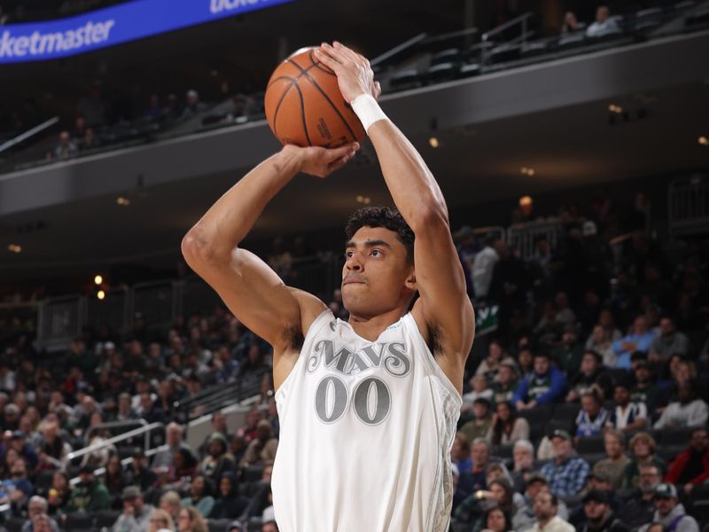 MILWAUKEE, WI - MARCH 5:  Max Christie #00 of the Dallas Mavericks shoots a three point basket during the game against the Milwaukee Bucks on March 5, 2025 at Fiserv Forum Center in Milwaukee, Wisconsin. NOTE TO USER: User expressly acknowledges and agrees that, by downloading and or using this Photograph, user is consenting to the terms and conditions of the Getty Images License Agreement. Mandatory Copyright Notice: Copyright 2025 NBAE (Photo by Gary Dineen/NBAE via Getty Images).