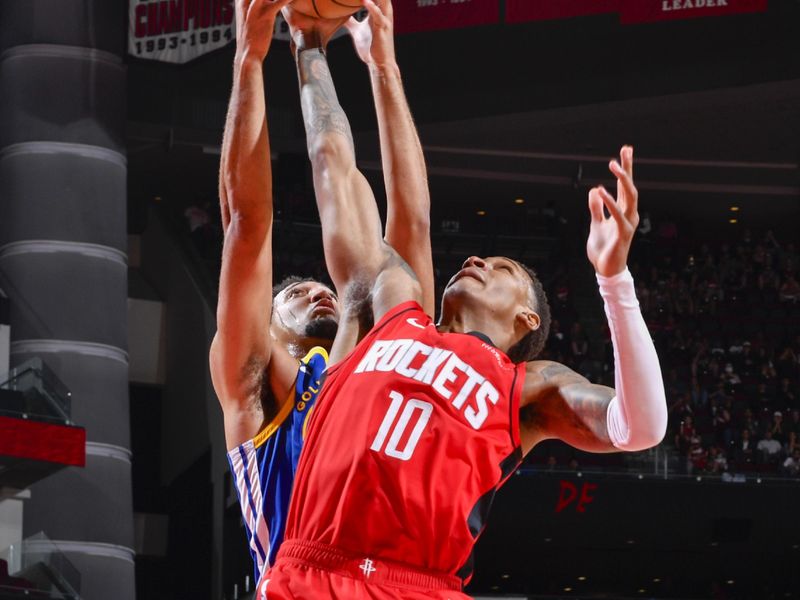 HOUSTON, TX - NOVEMBER 2:  Jabari Smith Jr. #10 of the Houston Rockets rebounds the ball during the game against the Golden State Warriors on October 22, 2024 at the Toyota Center in Houston, Texas. NOTE TO USER: User expressly acknowledges and agrees that, by downloading and or using this photograph, User is consenting to the terms and conditions of the Getty Images License Agreement. Mandatory Copyright Notice: Copyright 2024 NBAE (Photo by Logan Riely/NBAE via Getty Images)