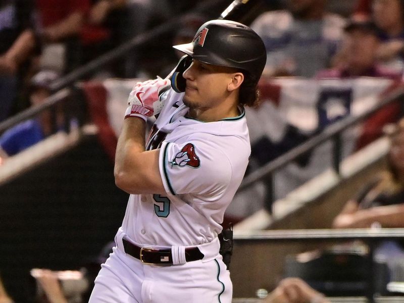 Oct 11, 2023; Phoenix, Arizona, USA; Arizona Diamondbacks center fielder Alek Thomas (5) hits a single against the Los Angeles Dodgers in the second inning for game three of the NLDS for the 2023 MLB playoffs at Chase Field. Mandatory Credit: Matt Kartozian-USA TODAY Sports