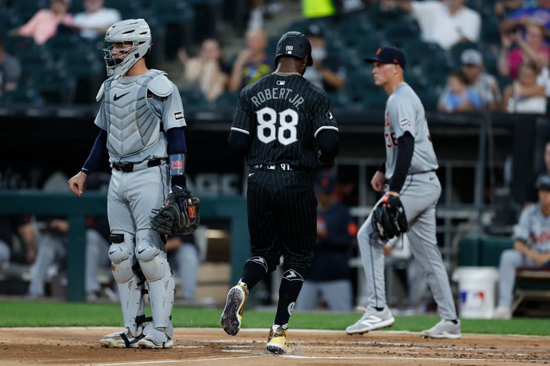 Aug 26, 2024; Chicago, Illinois, USA; Chicago White Sox outfielder Luis Robert Jr. (88) scores against the Detroit Tigers during the first inning  at Guaranteed Rate Field. Mandatory Credit: Kamil Krzaczynski-USA TODAY Sports