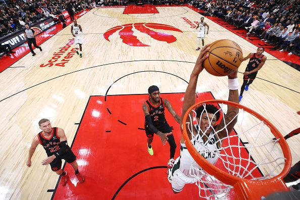 TORONTO, CANADA - NOVEMBER 15: MarJon Beauchamp #3 of the Milwaukee Bucks dunks as Jalen McDaniels #2 of the Toronto Raptors trails behind during the first half of their NBA game at Scotiabank Arena on November 15, 2023 in Toronto, Canada. NOTE TO USER: User expressly acknowledges and agrees that, by downloading and or using this photograph, User is consenting to the terms and conditions of the Getty Images License Agreement. (Photo by Cole Burston/Getty Images)