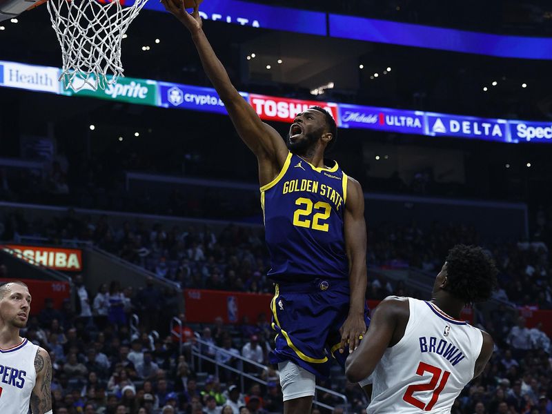 LOS ANGELES, CALIFORNIA - DECEMBER 14:  Andrew Wiggins #22 of the Golden State Warriors takes a shot against Kobe Brown #21 of the LA Clippers in the first half at Crypto.com Arena on December 14, 2023 in Los Angeles, California.  NOTE TO USER: User expressly acknowledges and agrees that, by downloading and/or using this photograph, user is consenting to the terms and conditions of the Getty Images License Agreement. (Photo by Ronald Martinez/Getty Images)