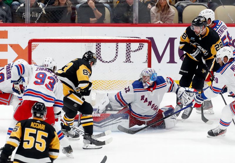 Nov 22, 2023; Pittsburgh, Pennsylvania, USA; New York Rangers goaltender Jonathan Quick (32) makes a save against Pittsburgh Penguins left wing Matt Nieto (83) during the third period at PPG Paints Arena. The Rangers won 1-0. Mandatory Credit: Charles LeClaire-USA TODAY Sports