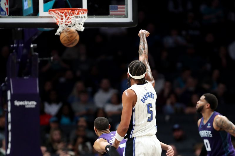 CHARLOTTE, NORTH CAROLINA - MARCH 05: Paolo Banchero #5 of the Orlando Magic watches his shot go in during the first half of an NBA game against the Charlotte Hornets at Spectrum Center on March 05, 2024 in Charlotte, North Carolina. NOTE TO USER: User expressly acknowledges and agrees that, by downloading and or using this photograph, User is consenting to the terms and conditions of the Getty Images License Agreement. (Photo by David Jensen/Getty Images)