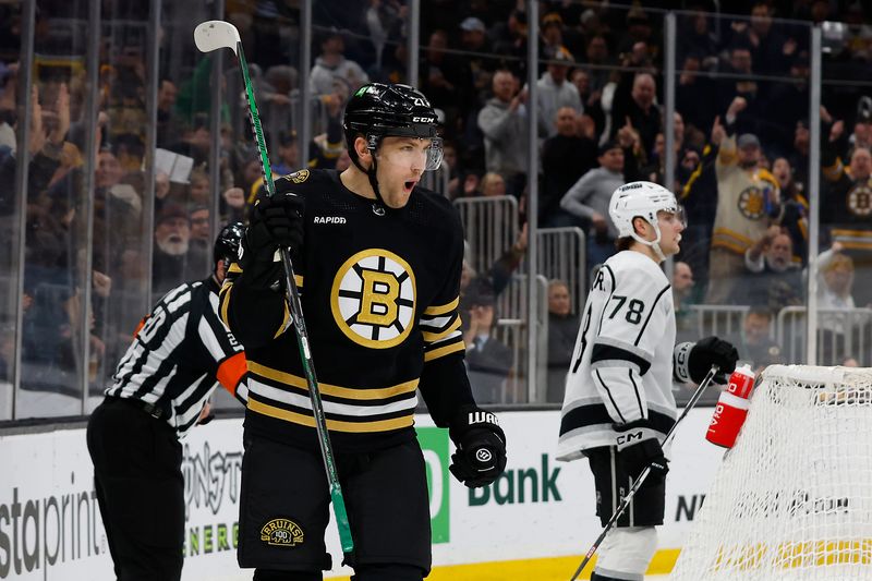 Feb 17, 2024; Boston, Massachusetts, USA; Boston Bruins left wing James van Riemsdyk (21) celebrates the first of his two goals during the first period as Los Angeles Kings right wing Alex Laferriere (78) skates away at TD Garden. Mandatory Credit: Winslow Townson-USA TODAY Sports