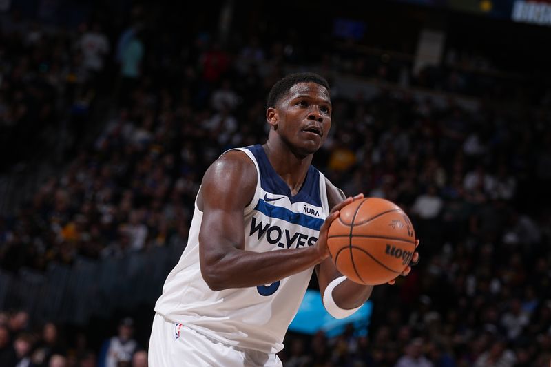 DENVER, CO - APRIL 10: Anthony Edwards #5 of the Minnesota Timberwolves shoots a free throw during the game against the Denver Nuggets on April 10, 2024 at the Ball Arena in Denver, Colorado. NOTE TO USER: User expressly acknowledges and agrees that, by downloading and/or using this Photograph, user is consenting to the terms and conditions of the Getty Images License Agreement. Mandatory Copyright Notice: Copyright 2024 NBAE (Photo by Bart Young/NBAE via Getty Images)