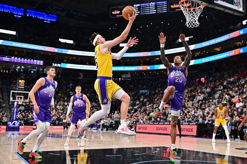 SALT LAKE CITY, UT - FEBRUARY 12: Austin Reaves #15 of the Los Angeles Lakers drives to the basket during the game against the Utah Jazz  on February 12, 2025 at Delta Center in Salt Lake City, Utah. NOTE TO USER: User expressly acknowledges and agrees that, by downloading and or using this Photograph, User is consenting to the terms and conditions of the Getty Images License Agreement. Mandatory Copyright Notice: Copyright 2025 NBAE (Photo by Jamie Sabau/NBAE via Getty Images)