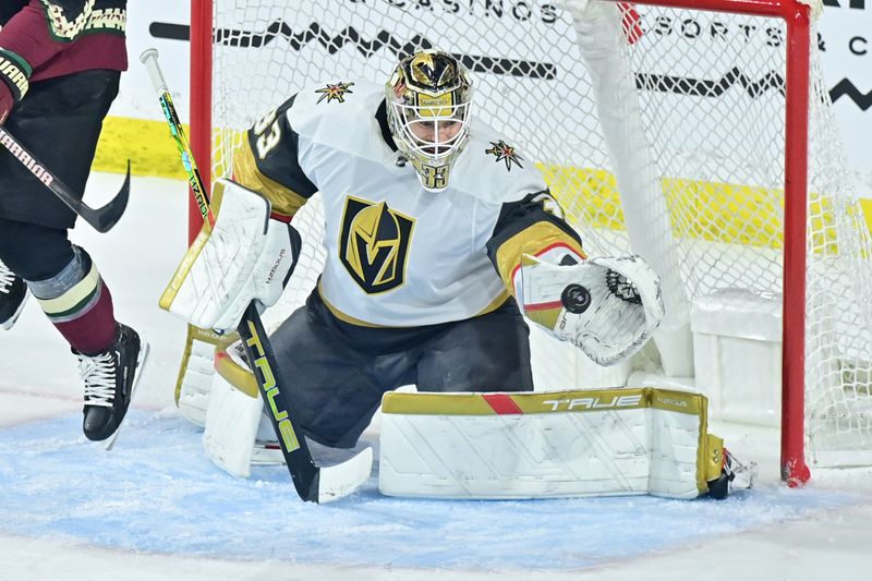 Feb 8, 2024; Tempe, Arizona, USA; Vegas Golden Knights goaltender Adin Hill (33) makes a save in the third period against the Arizona Coyotes at Mullett Arena. Mandatory Credit: Matt Kartozian-USA TODAY Sports