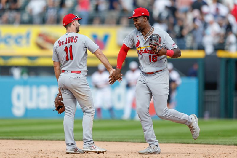 Jul 9, 2023; Chicago, Illinois, USA; St. Louis Cardinals shortstop Paul DeJong (11) celebrates with right fielder Jordan Walker (18) after defeating the Chicago White Sox at Guaranteed Rate Field. Mandatory Credit: Kamil Krzaczynski-USA TODAY Sports