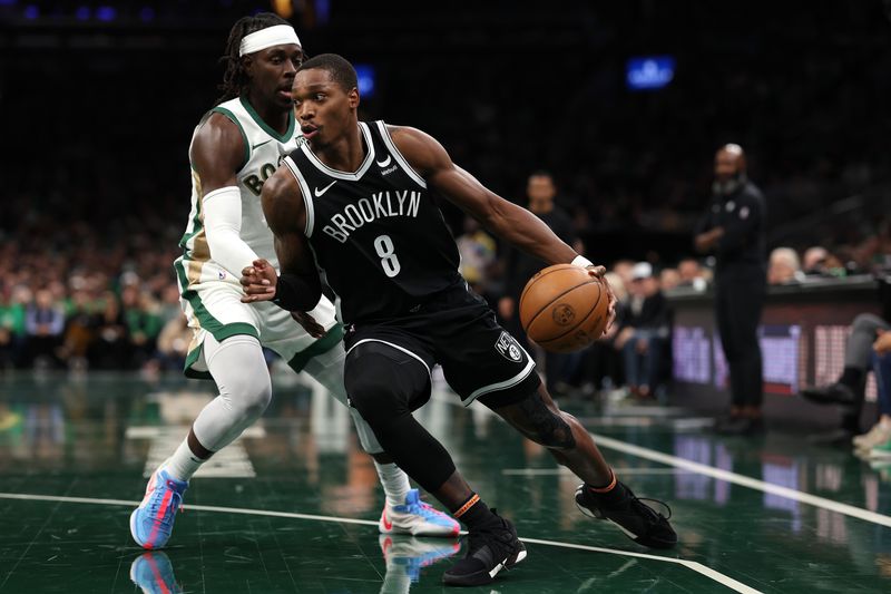 BOSTON, MASSACHUSETTS - NOVEMBER 10: Lonnie Walker IV #8 of the Brooklyn Nets drives to the basket against Jrue Holiday #4 of the Boston Celtics  during the second half of their In-Season Tournament game at TD Garden on November 10, 2023 in Boston, Massachusetts. The Celtics defeat the Nets 121-107. NOTE TO USER: User expressly acknowledges and agrees that, by downloading and or using this photograph, User is consenting to the terms and conditions of the Getty Images License Agreement. (Photo by Maddie Meyer/Getty Images)