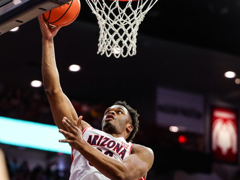Jan 24, 2026; Tucson, Arizona, USA; Arizona Wildcats forward Tobe Awaka (30) makes a layup during the second half of the game against the West Virginia Mountaineers at McKale Memorial Center. Mandatory Credit: Aryanna Frank-Imagn Images