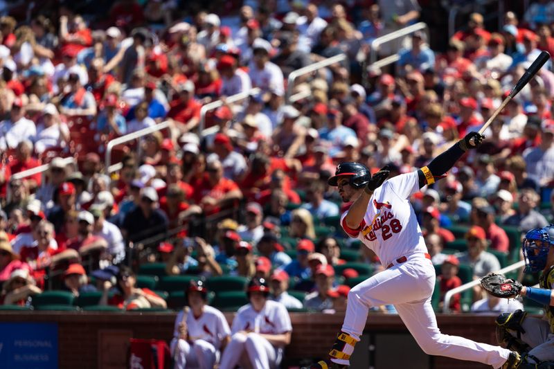 May 21, 2023; St. Louis, Missouri, USA; St. Louis Cardinals Nolan Arenado (28) hits a single against the Los Angeles Dodgers at Busch Stadium. Mandatory Credit: Zach Dalin-USA TODAY Sports