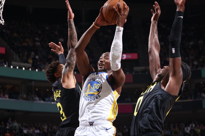 SALT LAKE CITY, UT - OCTOBER 25: Jonathan Kuminga #00 of the Golden State Warriors drives to the basket during the game on October 25, 2024 at Delta Center in Salt Lake City, Utah. NOTE TO USER: User expressly acknowledges and agrees that, by downloading and or using this Photograph, User is consenting to the terms and conditions of the Getty Images License Agreement. Mandatory Copyright Notice: Copyright 2024 NBAE (Photo by Melissa Majchrzak/NBAE via Getty Images)