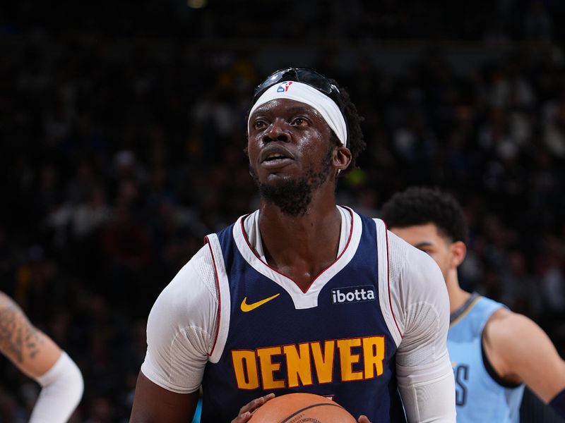 DENVER, CO - MARCH 25: Reggie Jackson #7 of the Denver Nuggets shoots a free throw during the game against the Memphis Grizzlies on March 25, 2024 at the Ball Arena in Denver, Colorado. NOTE TO USER: User expressly acknowledges and agrees that, by downloading and/or using this Photograph, user is consenting to the terms and conditions of the Getty Images License Agreement. Mandatory Copyright Notice: Copyright 2024 NBAE (Photo by Garrett Ellwood/NBAE via Getty Images)