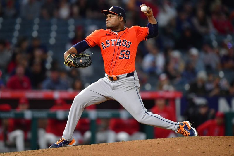 Jun 7, 2024; Anaheim, California, USA; Houston Astros pitcher Framber Valdez (59) throws against the Los Angeles Angels during the ninth inning at Angel Stadium. Mandatory Credit: Gary A. Vasquez-USA TODAY Sports