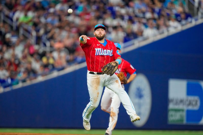 Aug 12, 2023; Miami, Florida, USA; Miami Marlins third baseman Jake Burger (36) throws the ball to first base for an out against the New York Yankees during the sixth inning at loanDepot Park. Mandatory Credit: Rich Storry-USA TODAY Sports