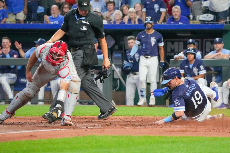 Aug 23, 2024; Kansas City, Missouri, USA; Philadelphia Phillies catcher J.T. Realmuto (10) can’t make the tag as Kansas City Royals second baseman Michael Massey (19) scores in the third inning at Kauffman Stadium. Mandatory Credit: Denny Medley-USA TODAY Sports