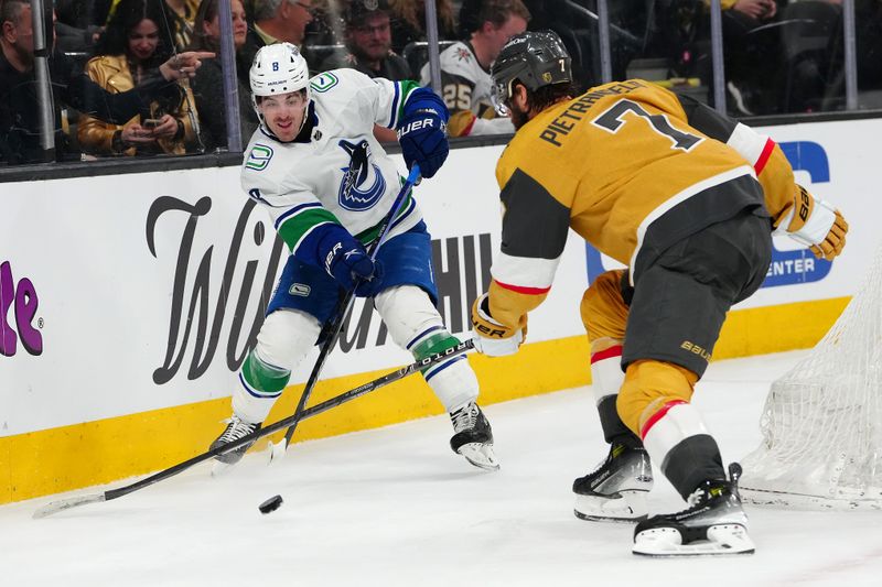 Apr 2, 2024; Las Vegas, Nevada, USA; Vancouver Canucks right wing Conor Garland (8) makes a pass around Vegas Golden Knights defenseman Alex Pietrangelo (7) during the second period at T-Mobile Arena. Mandatory Credit: Stephen R. Sylvanie-USA TODAY Sports