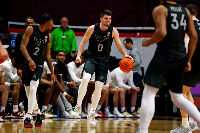 Jan 23, 2024; Blacksburg, Virginia, USA; Virginia Tech Hokies guard Hunter Cattoor (0) celebrates after the Virginia Tech Hokies beat the Boston College Eagles at Cassell Coliseum. Mandatory Credit: Peter Casey-USA TODAY Sports