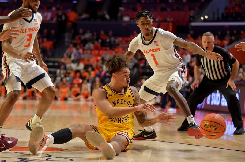 Feb 20, 2023; Champaign, Illinois, USA;  Minnesota Golden Gophers guard Jaden Henley (24) falls to the floor and passes the ball between Illinois Fighting Illini guard Jayden Epps (3) and  Sencire Harris (1) during the second half at State Farm Center. Mandatory Credit: Ron Johnson-USA TODAY Sports