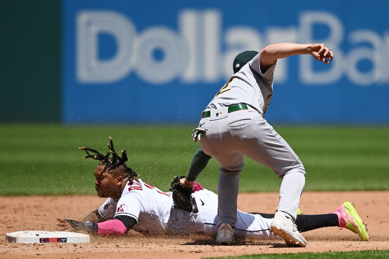 Jun 22, 2023; Cleveland, Ohio, USA; Cleveland Guardians third baseman Jose Ramirez (11) is caught stealing by Oakland Athletics shortstop Aledmys Diaz (12) during the fourth inning at Progressive Field. Mandatory Credit: Ken Blaze-USA TODAY Sports