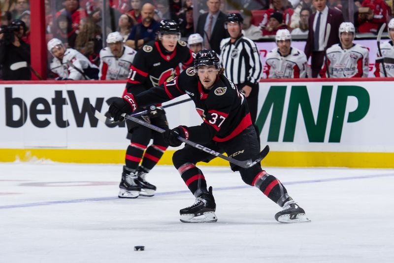 Jan 16, 2025; Ottawa, Ontario, CAN; Ottawa Senators defenseman Donovan Sebrango (37) moves the puck in the first period against the Washington Capitals at the Canadian Tire Centre. Mandatory Credit: Marc DesRosiers-Imagn Images