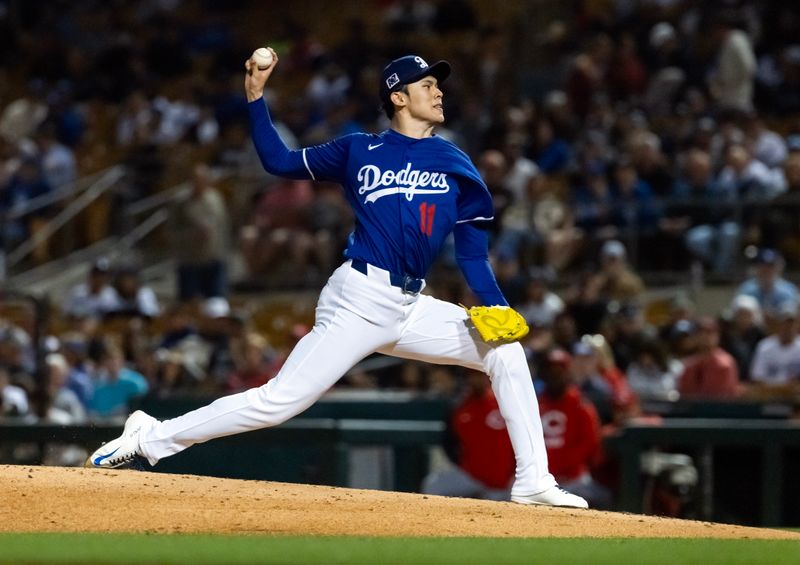 Mar 4, 2025; Phoenix, Arizona, USA; Los Angeles Dodgers pitcher Roki Sasaki against the Cincinnati Reds during a spring training game at Camelback Ranch-Glendale. Mandatory Credit: Mark J. Rebilas-Imagn Images