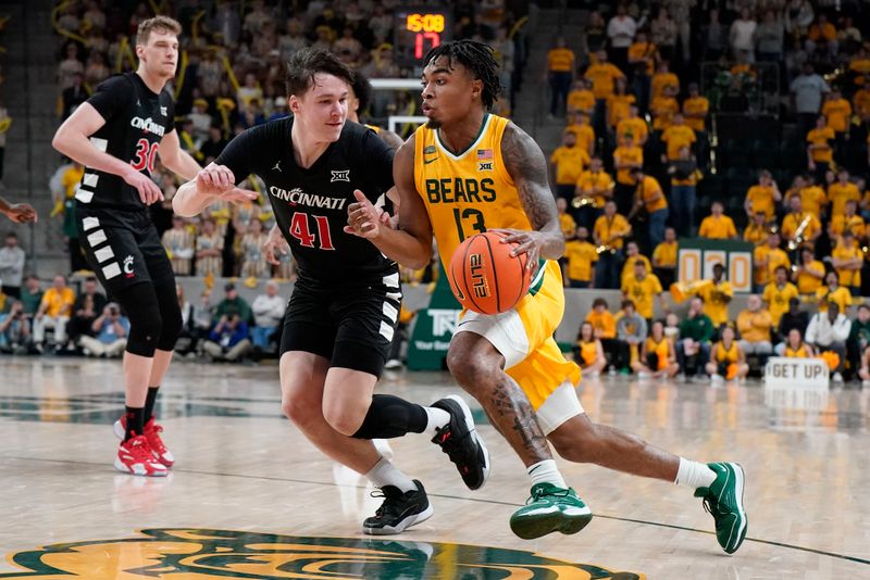 Jan 13, 2024; Waco, Texas, USA; Baylor Bears guard Langston Love (13) works around Cincinnati Bearcats guard Simas Lukosius (41) during the second half at Paul and Alejandra Foster Pavilion. Mandatory Credit: Raymond Carlin III-USA TODAY Sports