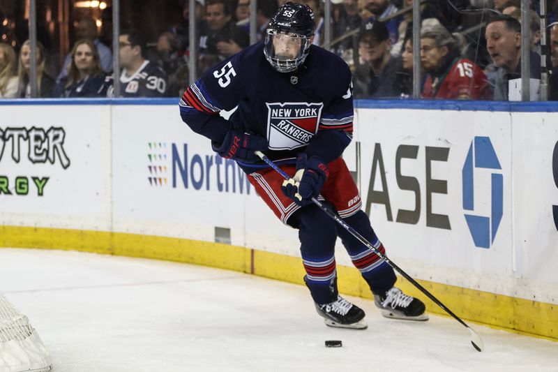 Oct 24, 2024; New York, New York, USA;  New York Rangers defenseman Ryan Lindgren (55) controls the puck in the first period against the Florida Panthers at Madison Square Garden. Mandatory Credit: Wendell Cruz-Imagn Images